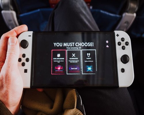 Smartphone displaying a fictional mobile game interface at an Australian gaming technology exhibition